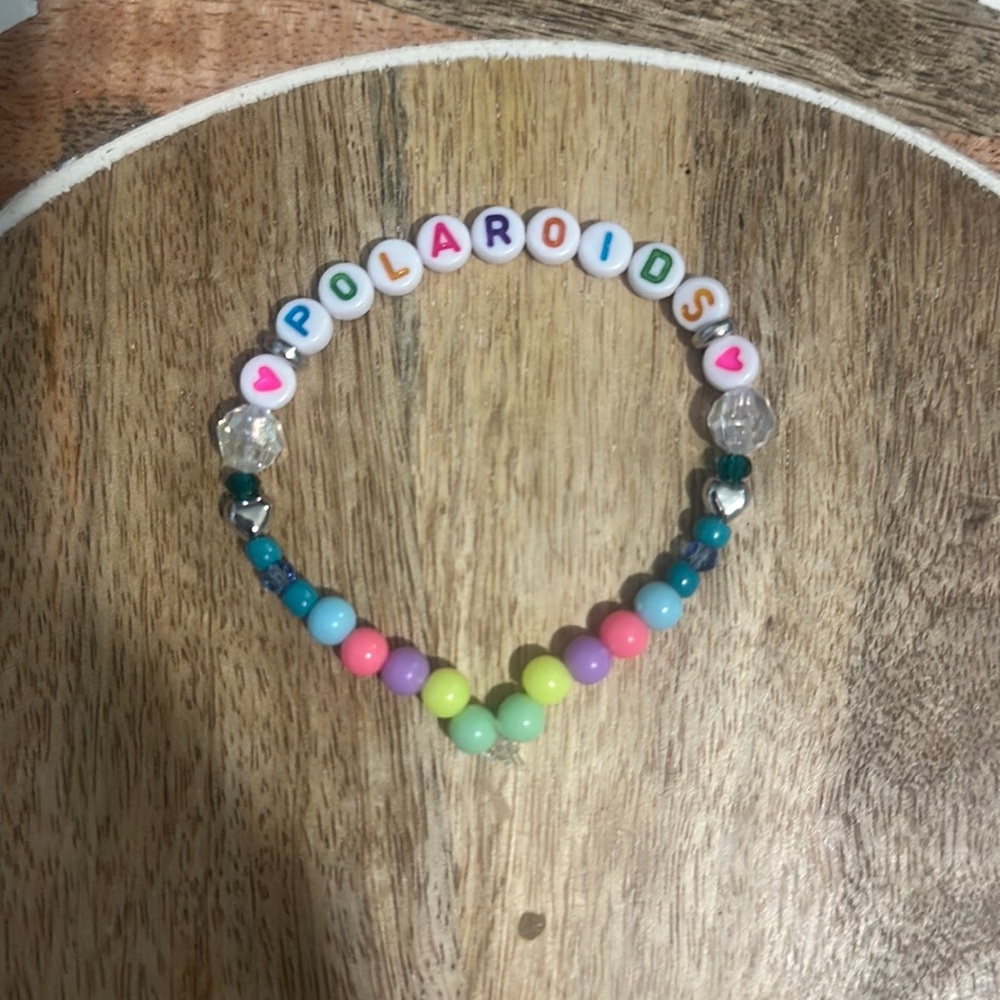 Taylor Swift Handmade Friendship Beaded Bracelet
“Polaroids” (Out Of The Woods)